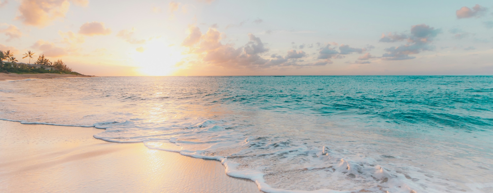 Calm, reflective wellness background of a beach at sunset